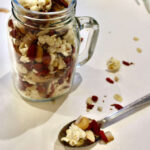 Sweet and salty healthy trail mix in a glass jar